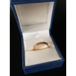 FOURTEEN CARAT GOLD WEDDING BAND with textured finish, ring size O and approximately 2.5 grams