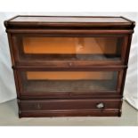 MAHOGANY BOOKCASE with a moulded top above two glass panel up and over doors with a shaped drawer