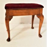 H & A.G. ALEXANDER OAK PIANO STOOL with a stuffover lift up seat, standing on cabriole supports