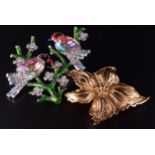 TWO DESIGNER BROOCHES one a Christian Dior gilt flower head; and the other by Butler and Wilson