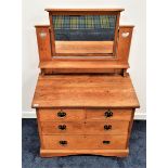 ARTS AND CRAFTS LIGHT OAK DRESSING CHEST with a rectangular mirror back flanked by a pair of