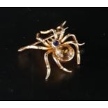 UNUSUAL CITRINE AND SAPPHIRE SET SPIDER BROOCH in unmarked high carat gold, approximately 2.6cm wide