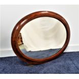 FIGURED WALNUT AND CROSSBANDED WALL MIRROR with an oval plate, 55cm x 70cm