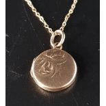 NINE CARAT GOLD CIRCULAR LOCKET PENDANT on nine carat gold chain, total weight approximately 3 grams