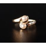 PEARL TWIST DESIGN RING with two pearls in fourteen carat gold, ring size Q and approximately 2.7