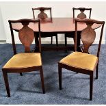 G PLAN MAHOGANY EXTENDING DINING TABLE with a pull apart top and fold out leaf, standing on twin