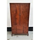 BEITHCRAFT MAHOGANY COMPACTUM with a moulded top above a pair of doors opening to reveal hanging