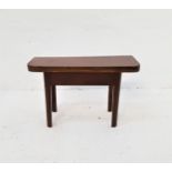 MAHOGANY OCCASIONAL TABLE with a fold over rotating top, standing on shaped supports, 59.5cm wide