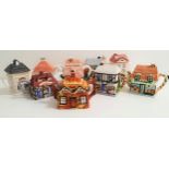 NINE NOVELTY TEAPOTS all in the form of cottages and other buildings, including The Baker's Shop,