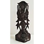 BALINESE TEAK CARVING depicting the bird god Garuda and other deities and mythical beasts, 32cm high