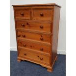 WAXED PINE CHEST with a moulded top above two short panelled drawers and four long panelled drawers,