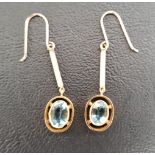 PAIR OF EDWARDIAN AQUAMARINE DROP EARRINGS in nine carat gold, the oval cut aquamarine on each in