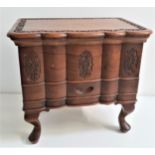 TEAK SEWING BOX with a carved and shaped lift up lid revealing a lift out tray with a storage