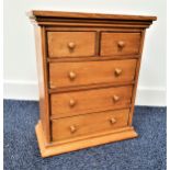 SMALL PINE CHEST OF DRAWERS with a rectangular top above two short and three long drawers,