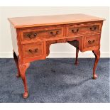 YEW KNEEHOLE DESK with a moulded top above two long and two short cockbeaded drawers, standing on