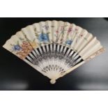 EARLY 19th CENTURY IVORY STICK FAN with pierced and painted sticks, the paper mount decorated with