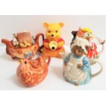 FIVE NOVELTY TEAPOTS comprising Winnie the Pooh, Noah's Ark, Mrs. Tiggy-Winkle, a Crown Dorset '