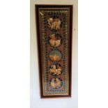 BALINESE EMBROIDERED PANEL depicting an elephant, dragon, bird, horse and mythical beast, framed and