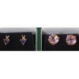 TWO PAIRS OF GEM SET TEN CARAT GOLD STUD EARRINGS comprising one pair of round cut amethyst studs,