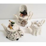 THREE LARGE NOVELTY TEAPOTS comprising one by Portmeirion in the form of a celebratory table, one by