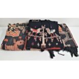 THREE PUA KUMBU BORNEO BATIK THROWS each decorated cloth made from two sections and decorated with