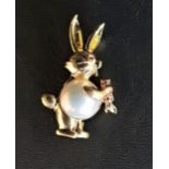 MABE PEARL SET RABBIT BROOCH in fourteen carat gold with ruby eye and ruby set carrot, 4.2cm high