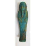 EGYPTIAN SHABTI with carved hieroglyphs to the lower half of the figure, 10.7cm high