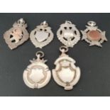 SIX VICTORIAN AND LATER SILVER MEDAL FOBS two with gold detail, one engraved to reverse 'Presented