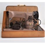 SINGER SEWING MACHINE with foot pedal and carry case, marked EM610418