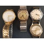 FOUR VINTAGE GENTLEMEN'S WRISTWATCHES Comprising Smiths Astral, Smiths De Luxe, Smiths Empire