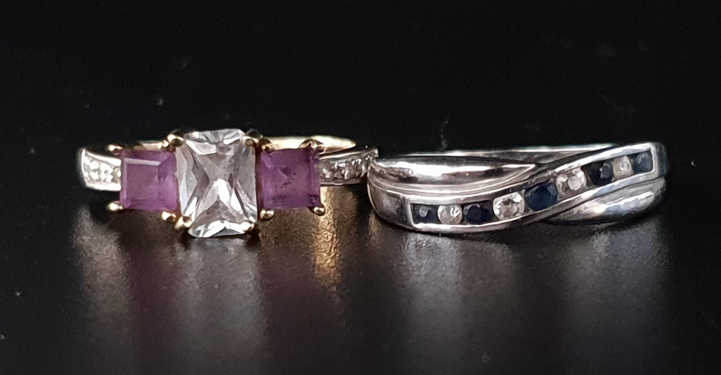 TWO GEM SET RINGS comprising an amethyst and CZ three stone ring in nine carat gold, and a channel