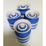FOUR ORIGINAL CORNISH KITCHENWARE STORAGE JARS decorated in blue and white, all with lids, 15.5cm