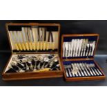 OAK CASED CANTEEN OF FISH KNIVES AND FORKS with Mother of Pearl handles, for twelve settings,