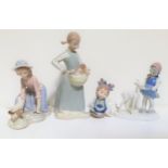 THREE NAO PORCELAIN FIGURINES depicting a young girl holding a cat, 23cm high, girl kneeling by a