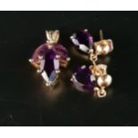 AMETHYST SUITE OF JEWELLERY comprising a pendant set with three marquise cut amethysts and a pair of