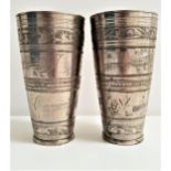 PAIR OF INDIAN WHITE METAL BEAKERS of tapering form and decorated with panels of birds and