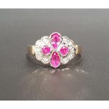 RUBY AND DIAMOND CLUSTER RING four round and oval cut central rubies flanked by five diamonds to