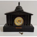 LATE VICTORIAN BLACK SLATE MANTLE CLOCK with a circular brass and enamel dial with Roman numerals