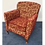 1950s ARMCHAIR with a shaped button back and padded arms above a seat cushion, standing on stout