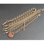 THREE GOLD PLATED ALBERT CHAINS one with revolving fob set with carnelian and bloodstone (3)