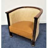 OAK ELBOW CHAIR with a hoop back covered in cream vinyl with decorative stud detail, with a padded