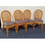SET OF FOUR CANED DINING CHAIRS with arched lattice backs above shaped padded seats, standing on