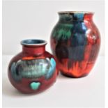 TWO POOLE POTTERY VASES comprising one in the Gemstone pattern, 16cm high, and a Volcano urn vase,