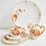 AYNSLEY TEA SET decorated in the Poppy pattern and comprising twelve cups, eleven saucers, twelve