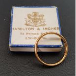 HAMILTON AND INCHES TWENTY-TWO CARAT GOLD WEDDING BAND ring size J and approximately 2 grams, in