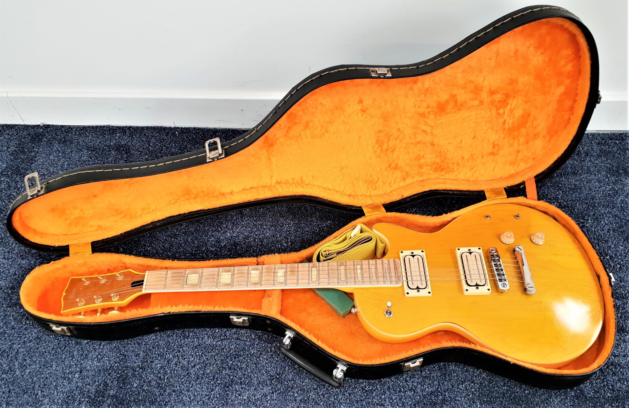 FLITE HAND BUILT ELECTRIC GUITAR with a stained ash yellow body, with two dials and two switches, in