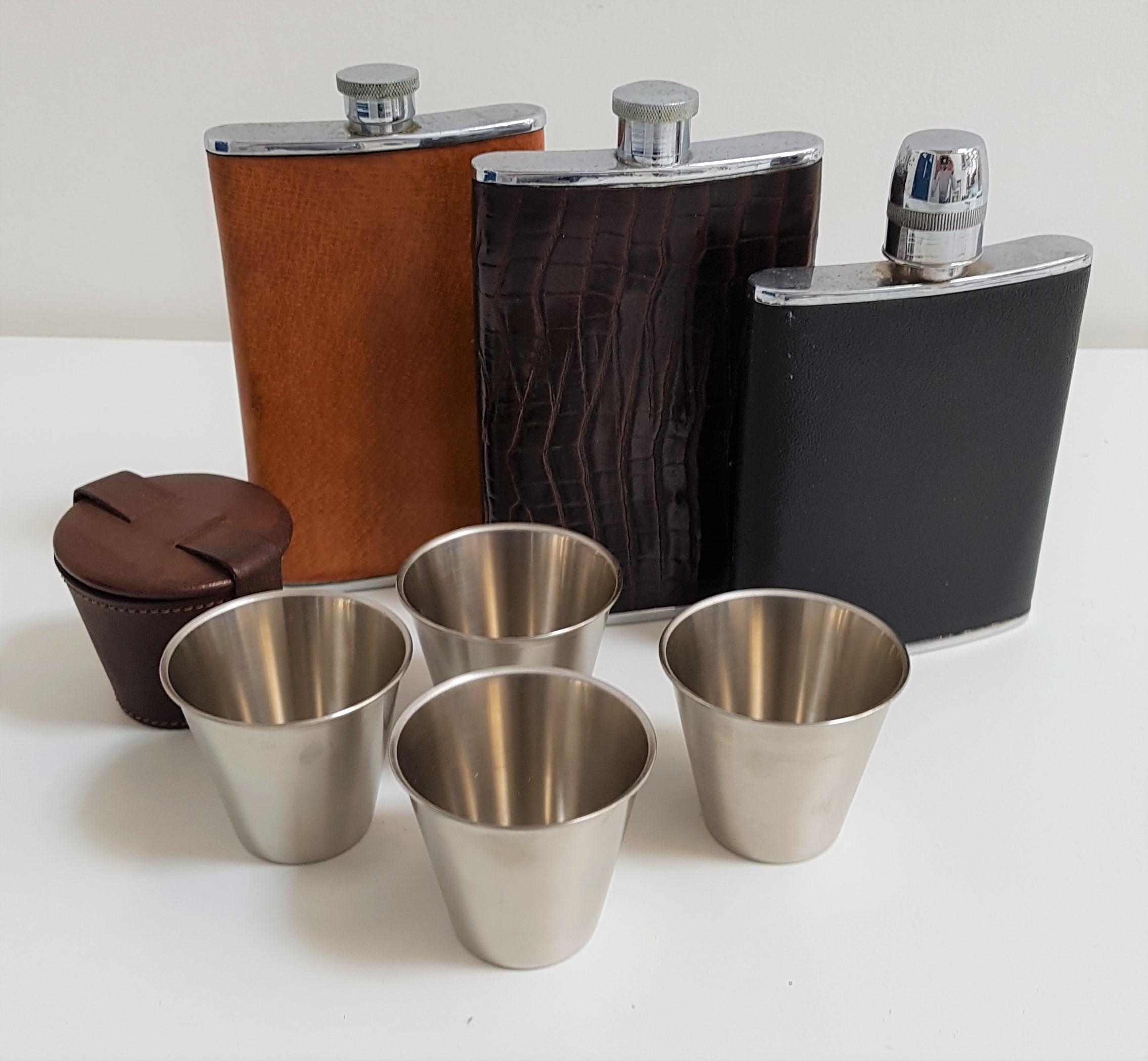 THREE HIP FLASKS two 8oz and one 6oz capacity and four stainless steel nip cups