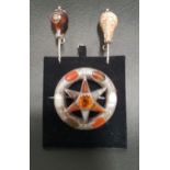 SCOTTISH AGATE AND CAIRNGORM SET BROOCH in unmarked silver, the central round cut Cairngorm in agate