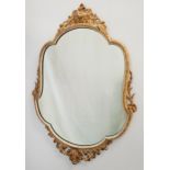 DECORATIVE SHAPED WALL MIRROR in a painted metal frame with gilt highlights, 81cm high
