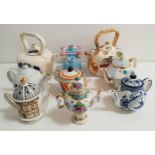 SELECTION OF NINE CERAMIC TEAPOTS including a Clarice Cliff inspired teapot, two barge ware teapots,